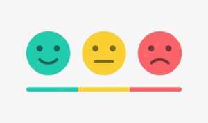 Three smiley emoji faces. From left to right: Smiling, neutral, sad.