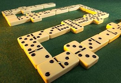 Domino tiles on a green board
