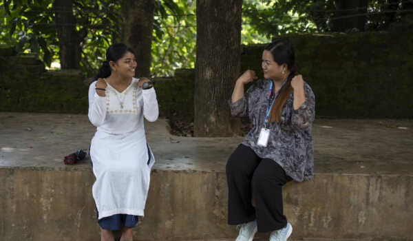 Ganga Nepali (17, left) with Krishnamaya Thapa (24) at Ganga’s school located in Bandipur Rural Municiapility, Nepal. Krishnamaya is a Community Campaigner at CBM Global partner KOSHISH Nepal, which has been providing regular mental-health counselling support to Ganga. Here, Ganga does breathing and stretching exercises along with Krishnamaya. Please refer to NPL-24-Field-Story-Mental-Health-Ganga-Nepali(17) for more information.