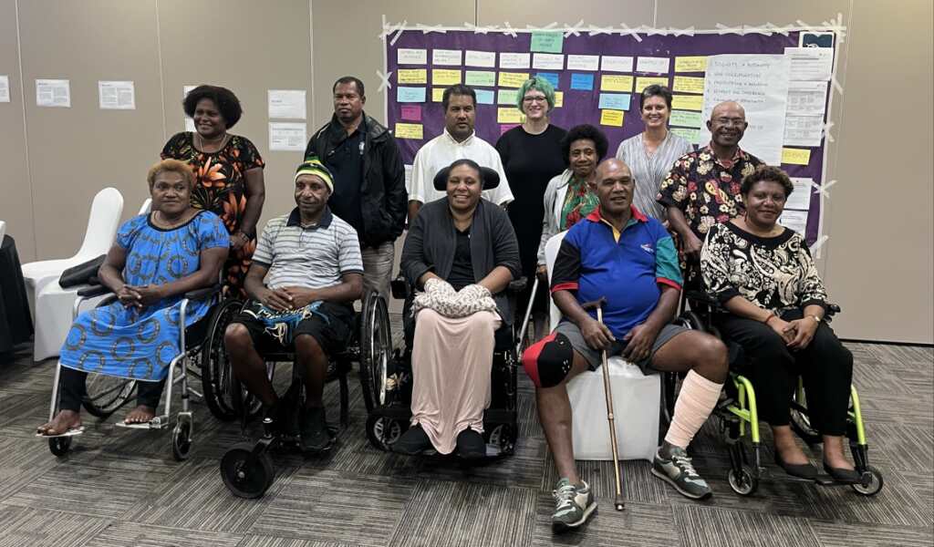 Participants of the PNG advisory capacity development programme, including persons with disabilities, during a group session